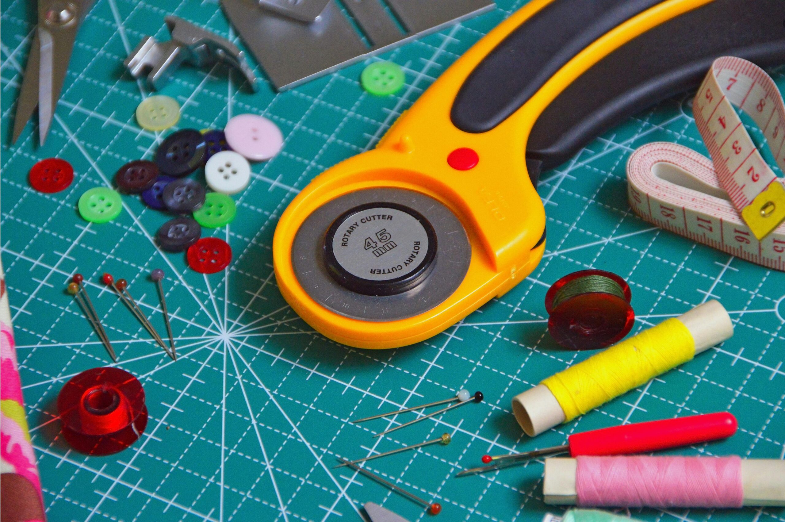 A stock image of a variety of colorful sewing tools.